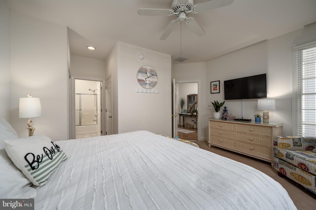 bedroom with ensuite bathroom and ceiling fan