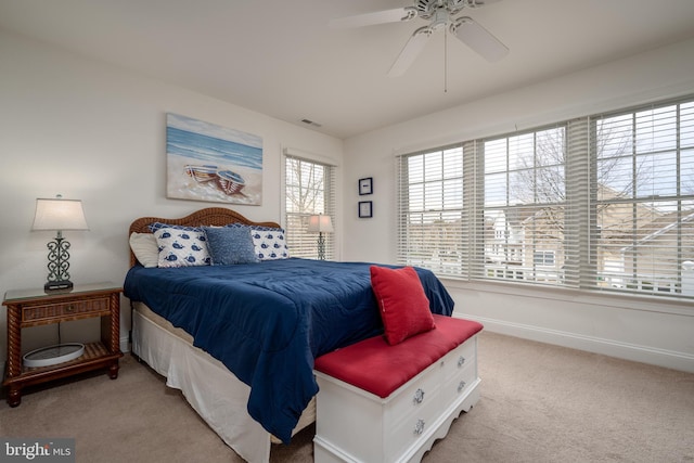 bedroom featuring ceiling fan and light carpet