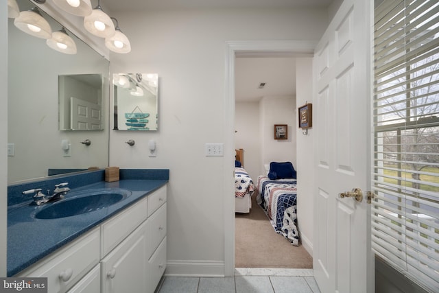 bathroom featuring tile patterned flooring and vanity