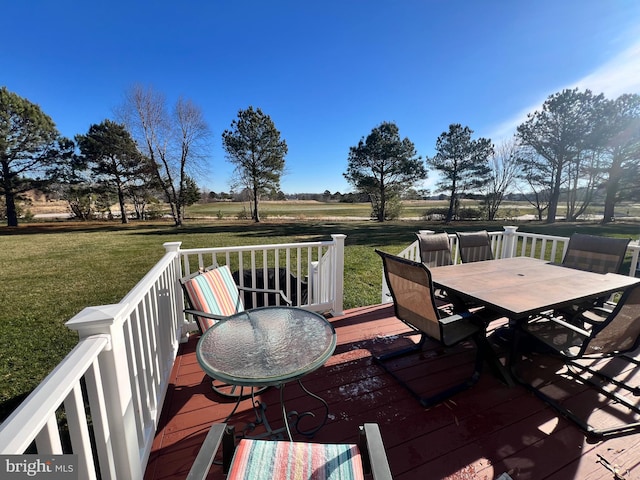 wooden deck with a lawn