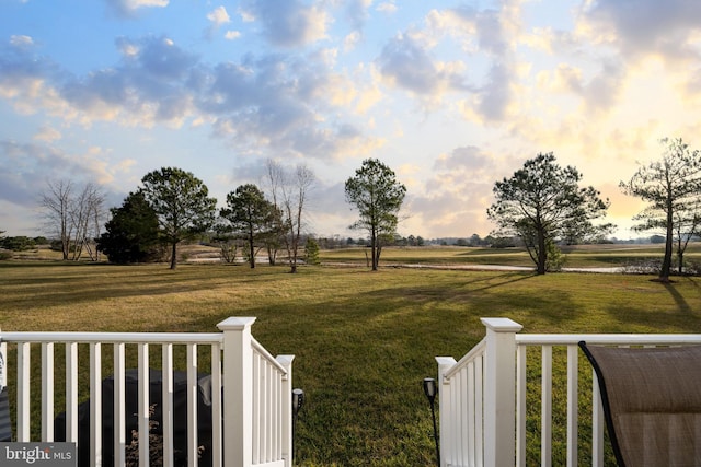 yard at dusk with a rural view