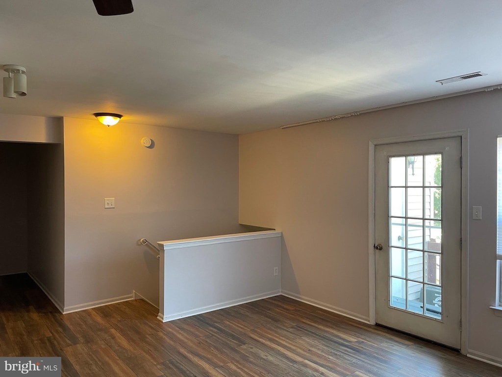 spare room featuring dark hardwood / wood-style flooring