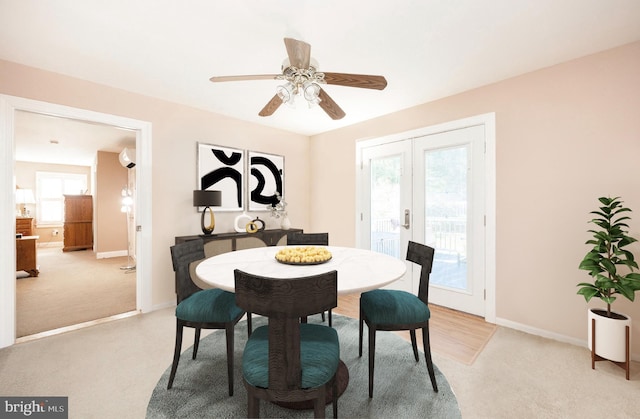 carpeted dining area with a wall mounted air conditioner, plenty of natural light, ceiling fan, and french doors