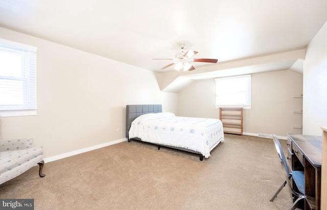 carpeted bedroom featuring ceiling fan and vaulted ceiling