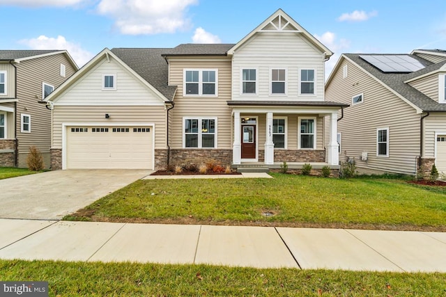 view of front of property with a garage and a front lawn