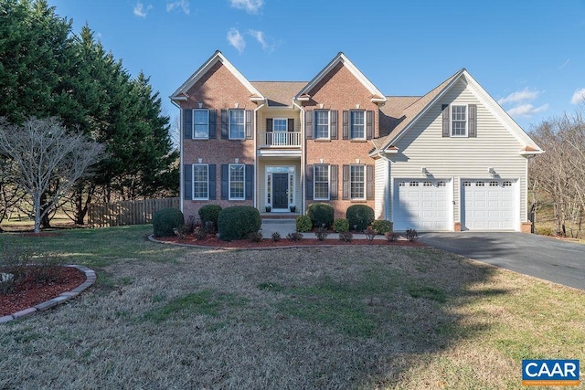 view of front of home with a garage and a front lawn