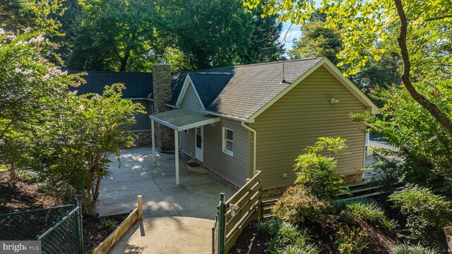 view of side of property featuring a patio area