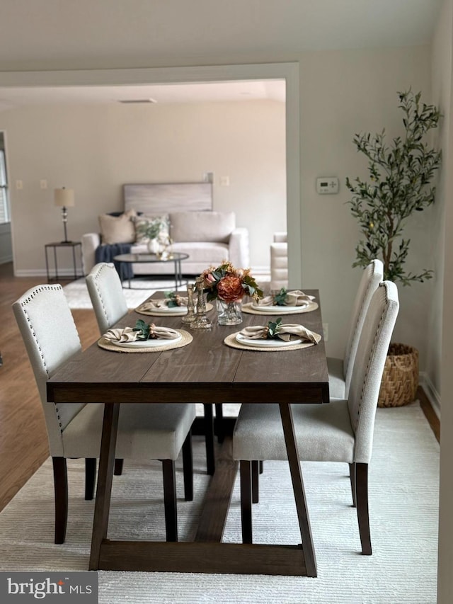 dining room with hardwood / wood-style floors