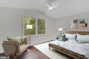 bedroom featuring ceiling fan, dark hardwood / wood-style flooring, and vaulted ceiling