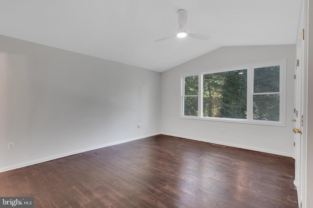 spare room featuring dark wood-type flooring, ceiling fan, and lofted ceiling