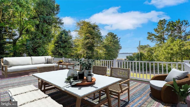 wooden terrace featuring an outdoor hangout area