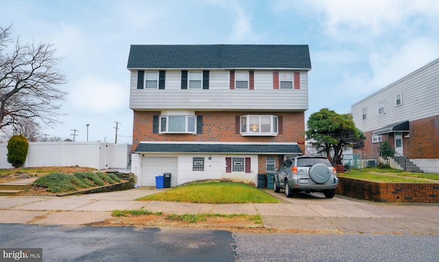 view of front of property featuring a garage