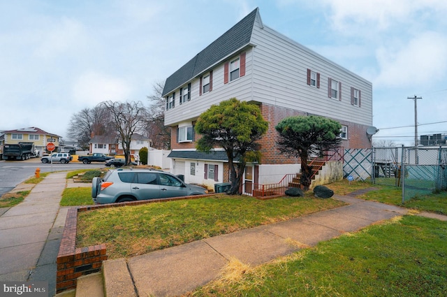 exterior space featuring a front lawn