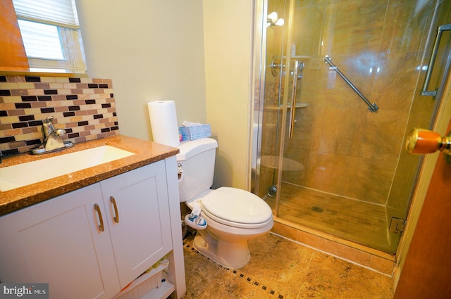 bathroom featuring decorative backsplash, toilet, an enclosed shower, and vanity