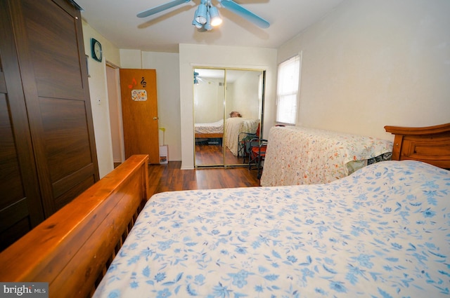 bedroom with a closet, ceiling fan, and dark hardwood / wood-style floors