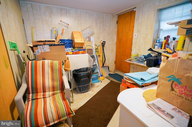 miscellaneous room with wooden walls