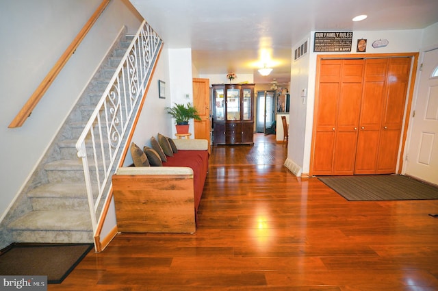 entrance foyer with dark hardwood / wood-style flooring