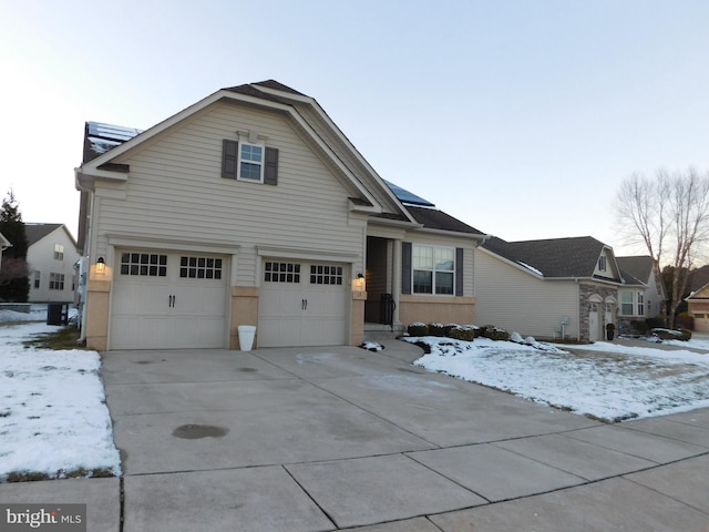 front of property with a garage