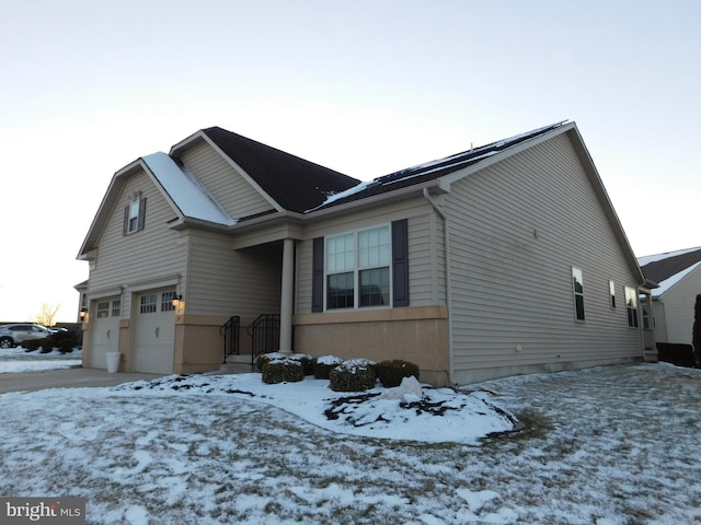 view of front of home with a garage