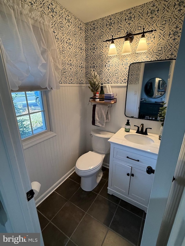 bathroom featuring tile patterned floors, vanity, and toilet