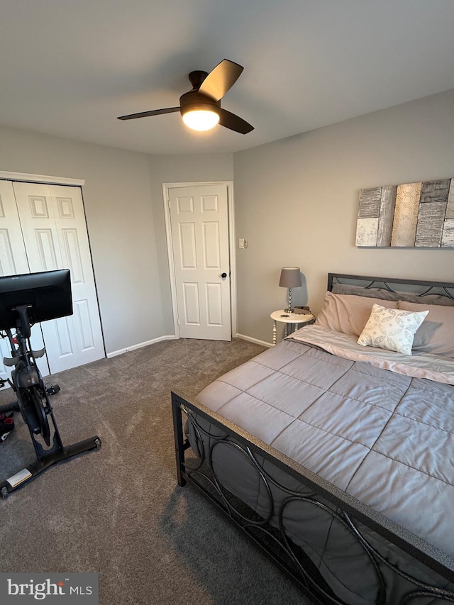 carpeted bedroom with a closet and ceiling fan