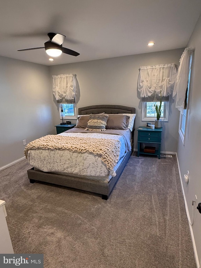 bedroom with dark carpet and ceiling fan