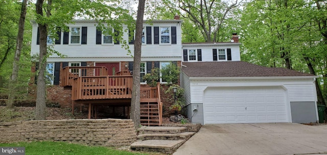 view of front facade with a garage and a deck