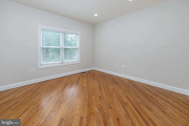 unfurnished room featuring light hardwood / wood-style flooring