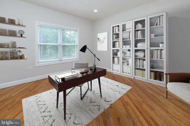 office space with hardwood / wood-style floors