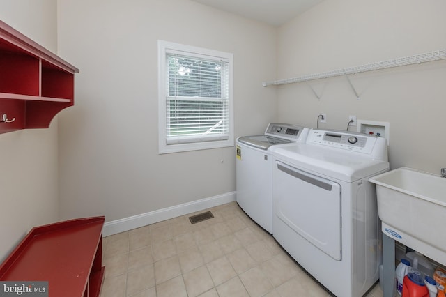 laundry area with washer and dryer and sink