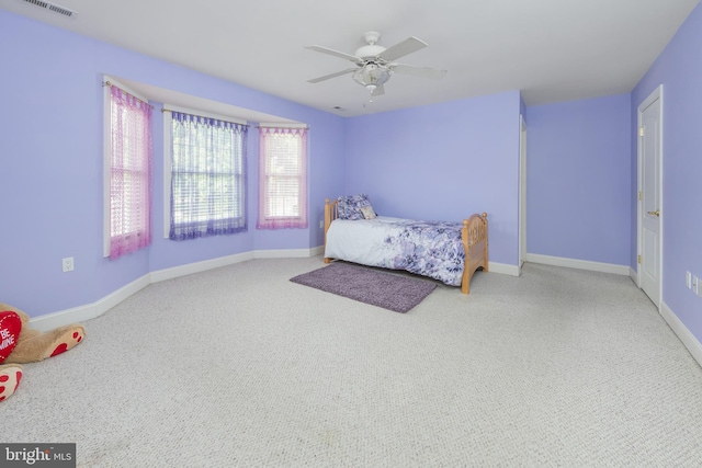 carpeted bedroom with ceiling fan