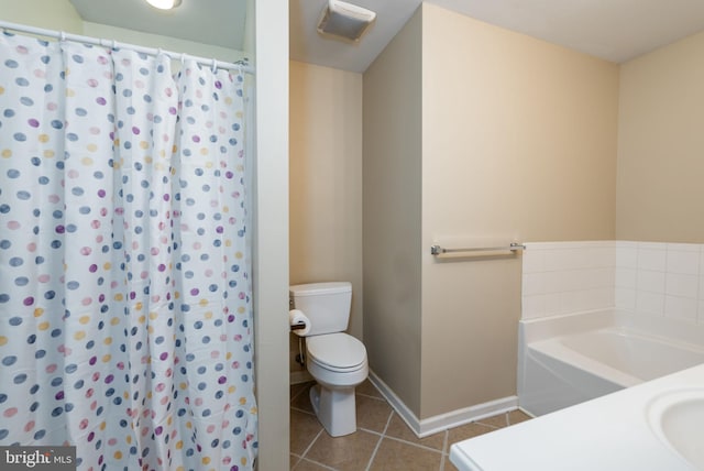 bathroom with tile patterned floors and toilet