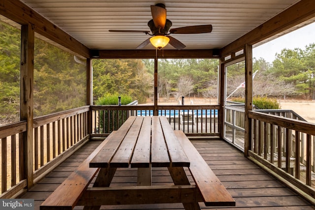 wooden deck featuring ceiling fan