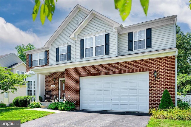 front of property with a garage