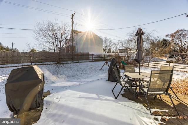 view of yard layered in snow