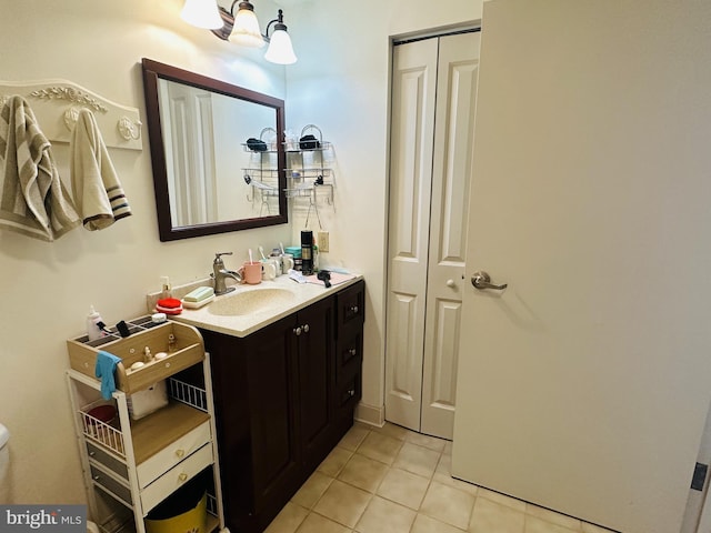 bathroom featuring tile patterned flooring and vanity