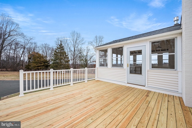 wooden terrace featuring a sunroom