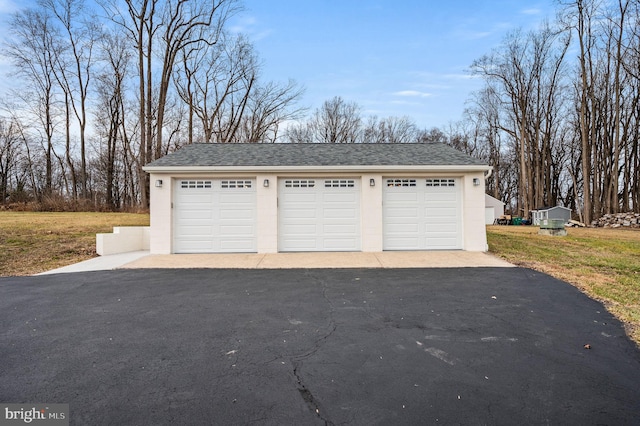 garage with a lawn