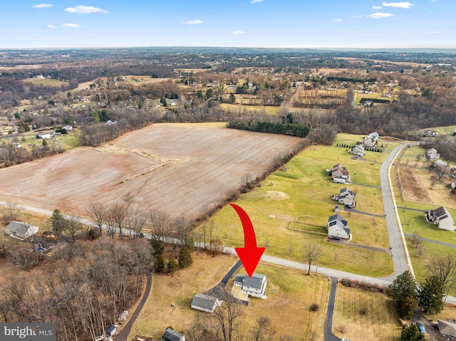 birds eye view of property featuring a rural view