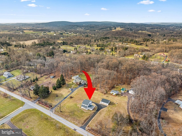 birds eye view of property with a rural view