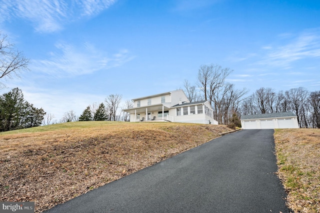 exterior space featuring a garage and an outdoor structure