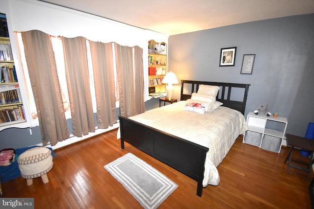 bedroom featuring dark wood-type flooring