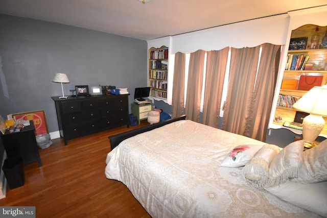 bedroom featuring dark hardwood / wood-style floors