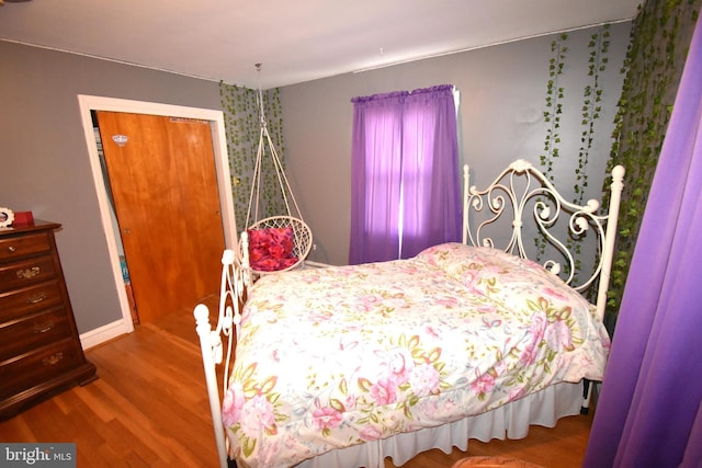 bedroom with hardwood / wood-style floors