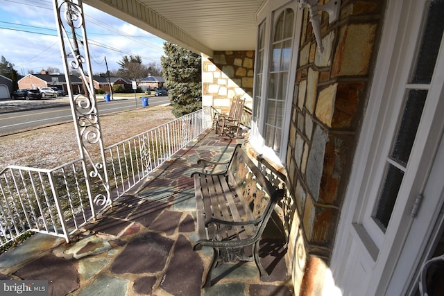 balcony featuring a porch