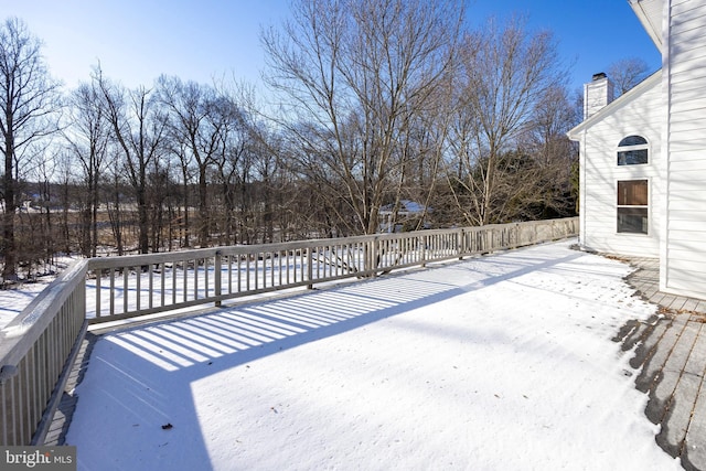 view of snow covered deck