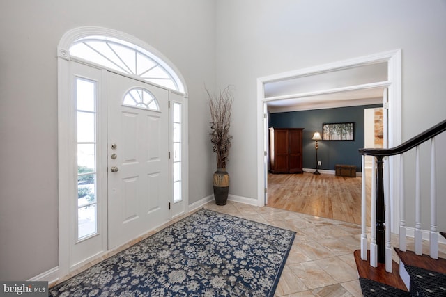 tiled foyer featuring a wealth of natural light