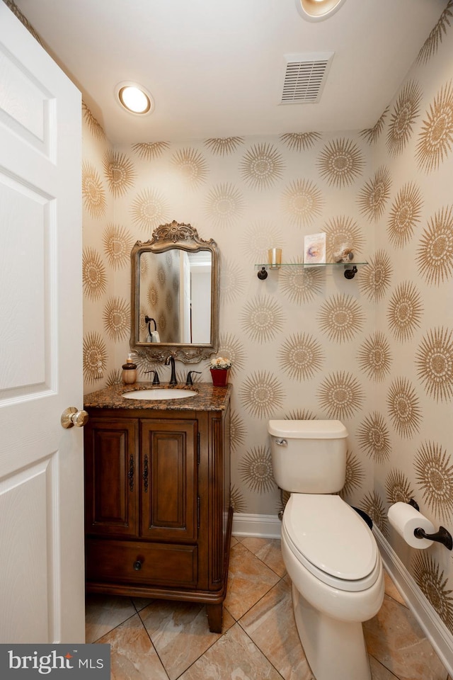 bathroom with vanity and toilet