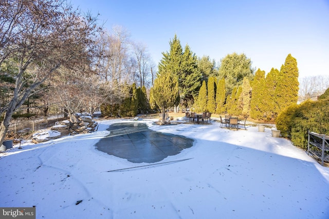 view of yard layered in snow