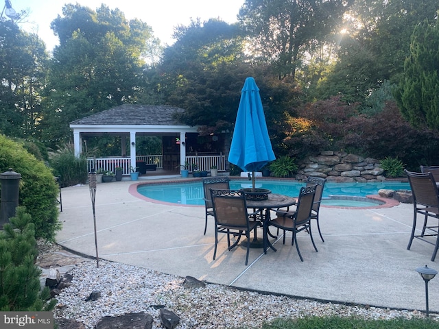 view of swimming pool with a gazebo, an in ground hot tub, and a patio